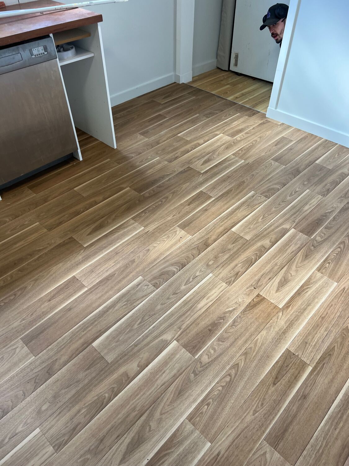 Wide-plank timber flooring in a finished room